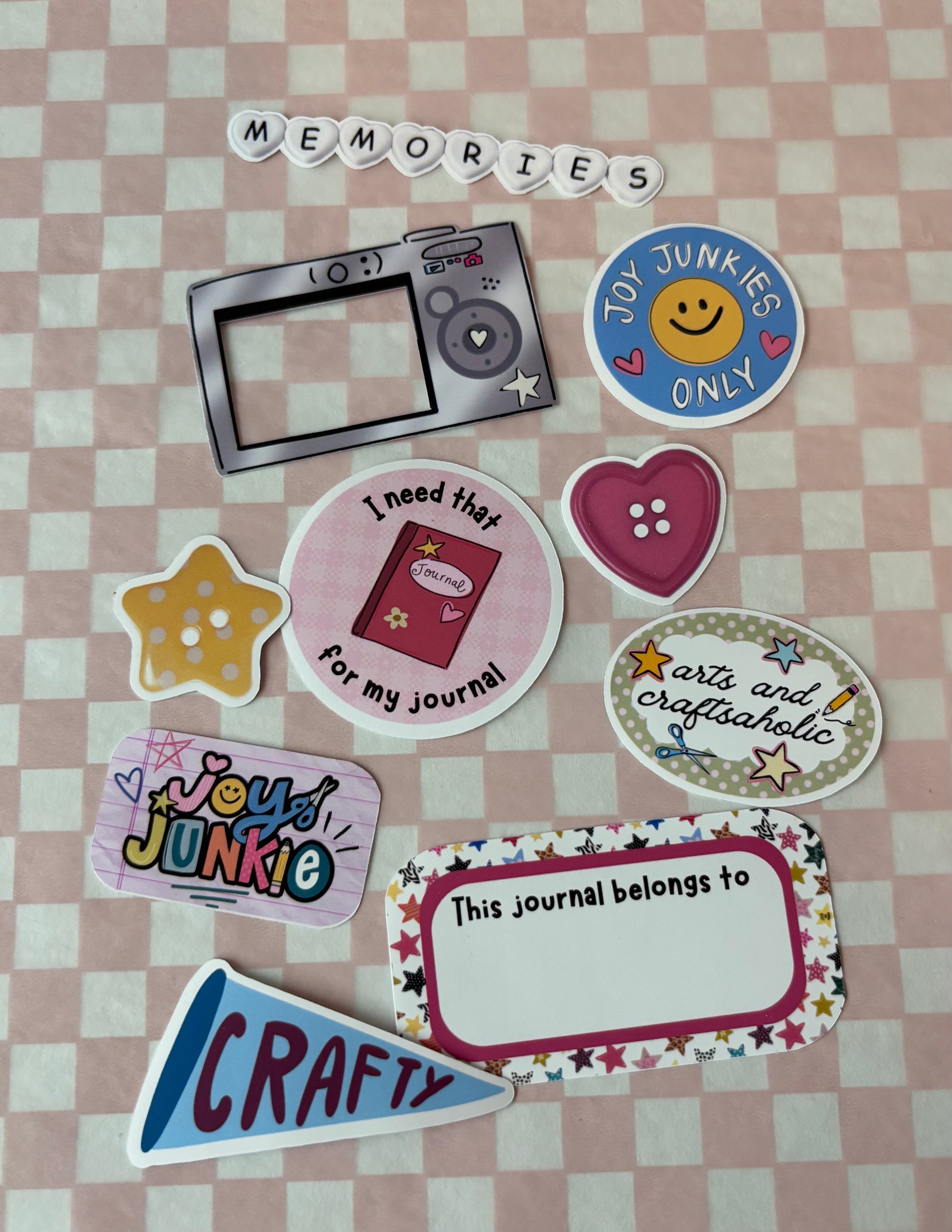 Collection of decorative stickers on a checkered background