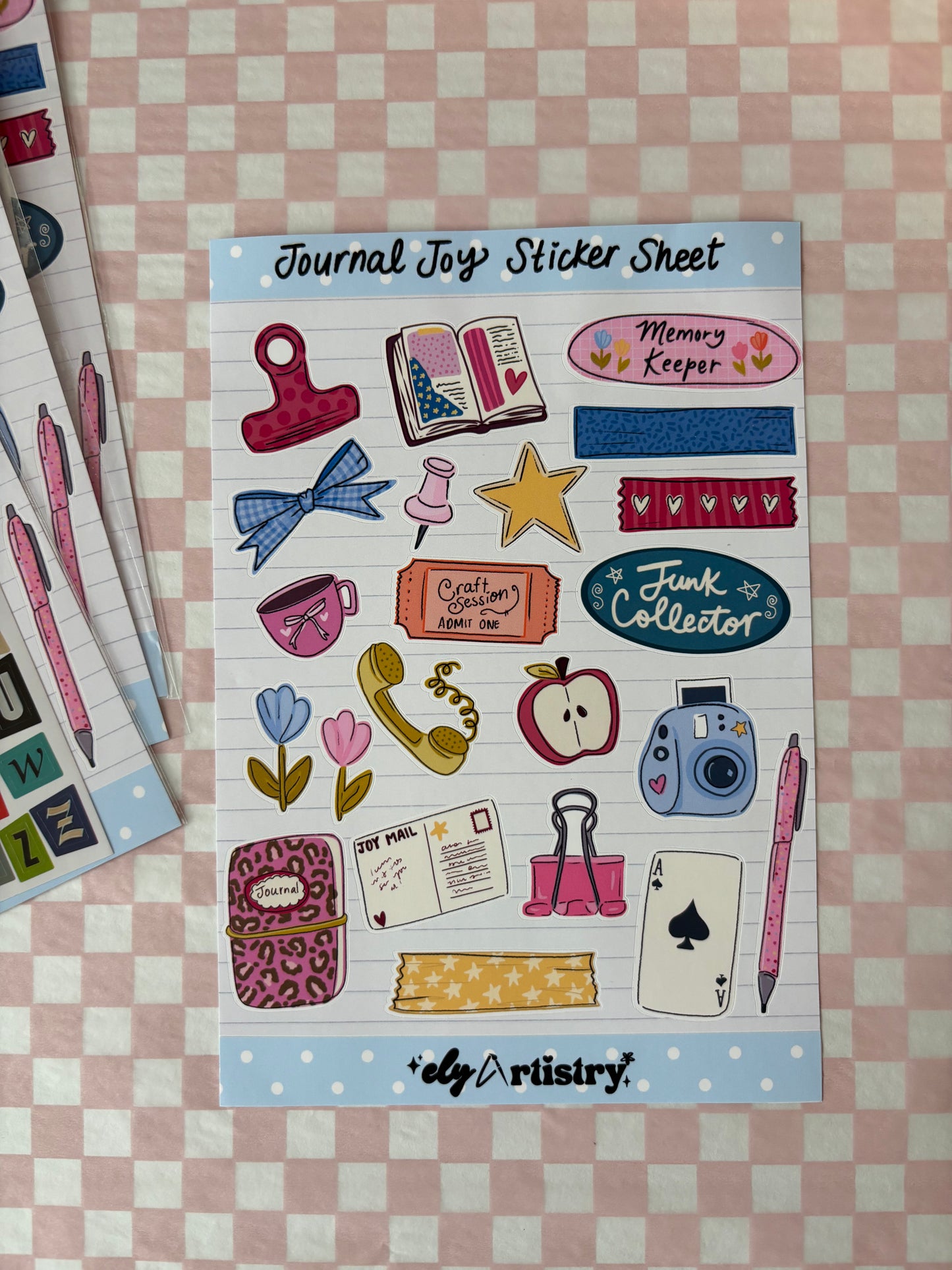 Sheet of colorful stickers with various designs on a checkered background