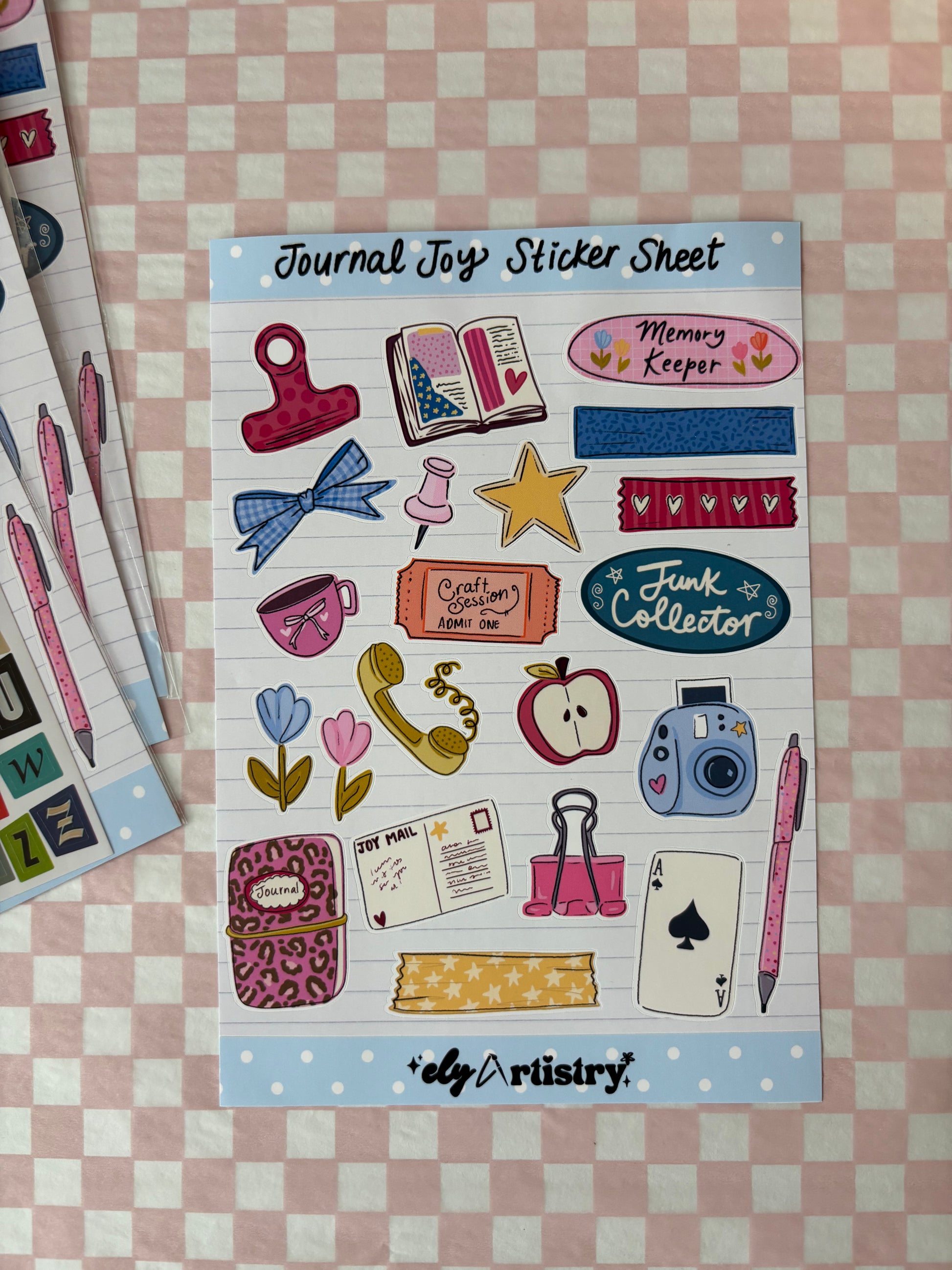 Sheet of colorful stickers with various designs on a checkered background